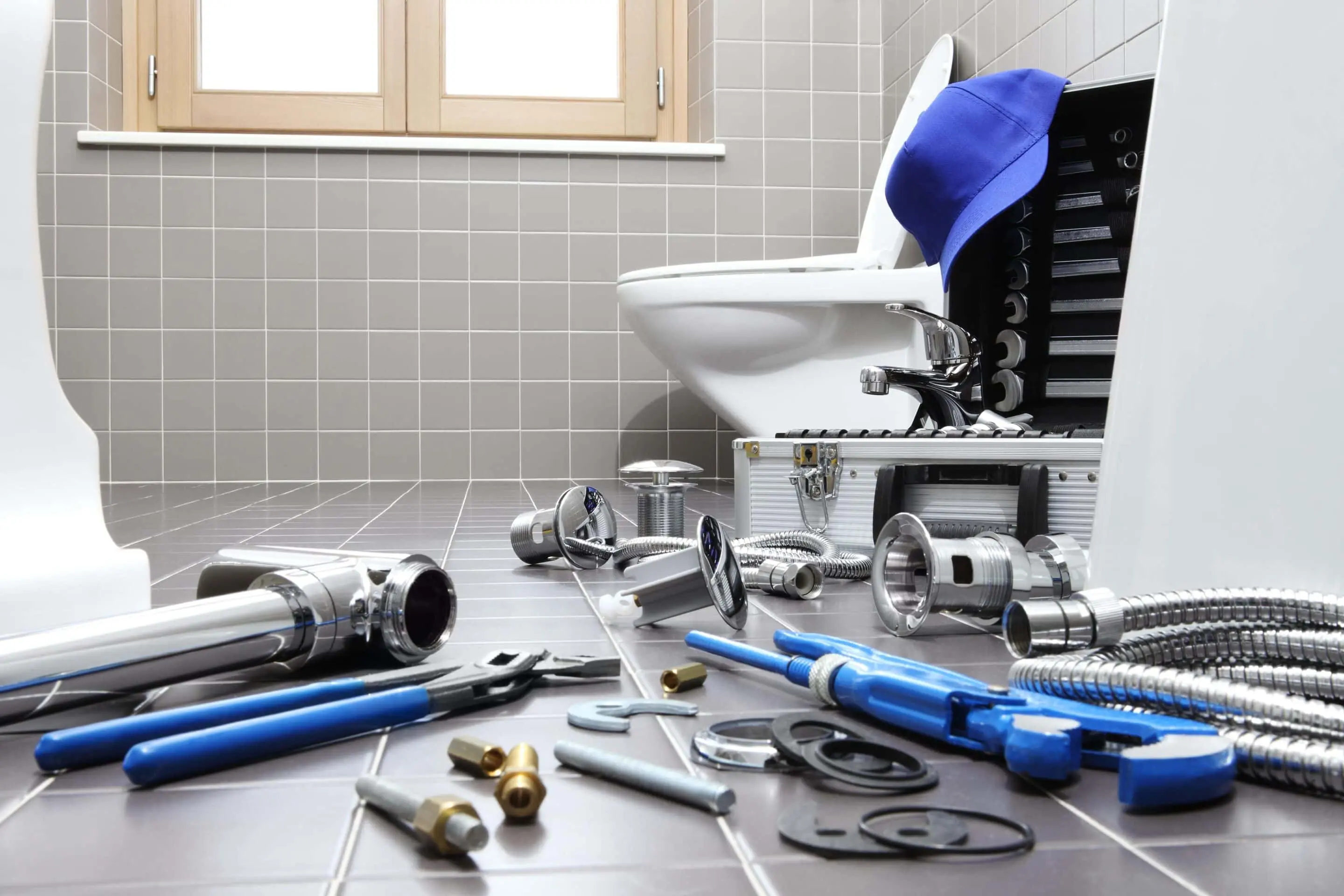 bigstock-Plumber-Tools-And-Equipment-In-399729179-min