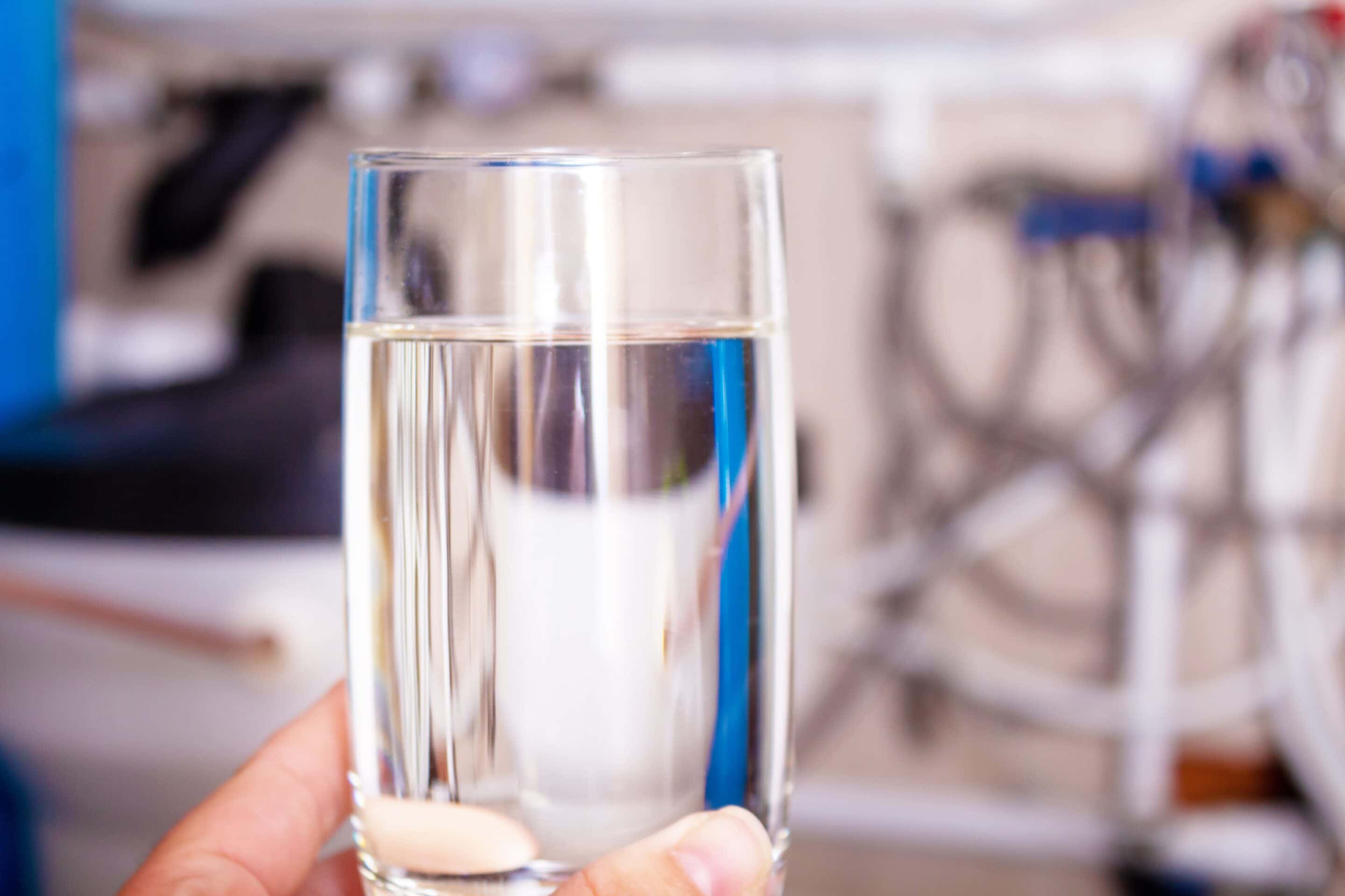 bigstock-Clean-Water-Glass-In-Hand-Wat-432407402-min