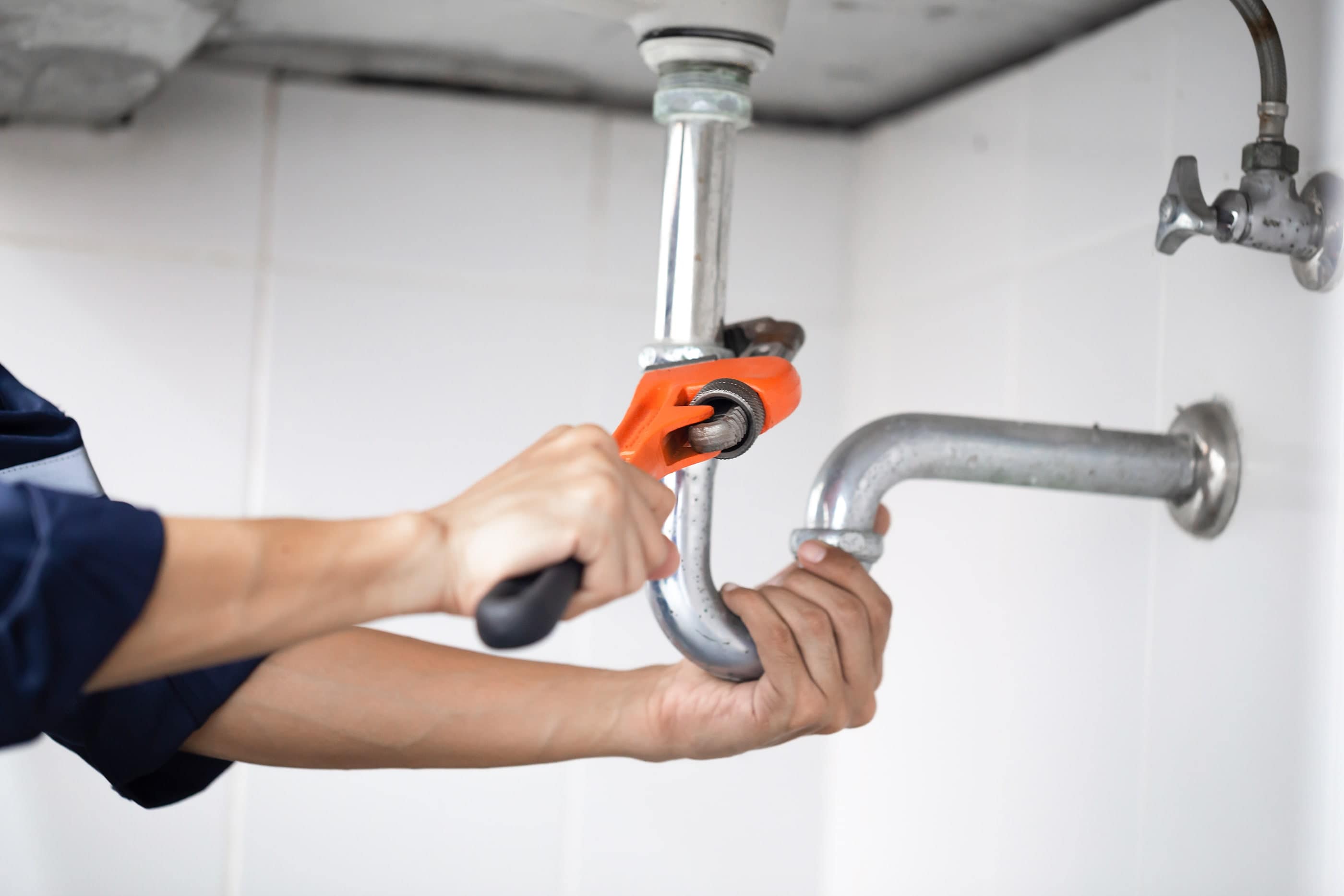 bigstock-Plumber-At-Work-In-A-Bathroom--438705917-min